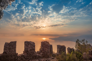 Fortress wall on mountain view of sunset on sea