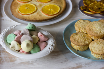 Tea with orange tarts and muffins