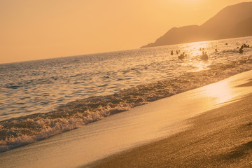 Sunset on sea in evening of summer beach