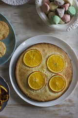 Tea with orange tarts and muffins