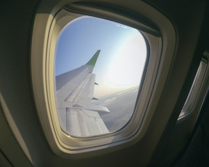 Fototapeta premium Aiplane Aircraft windows view on the wing aircraft, airlines , aviation skyline transportation