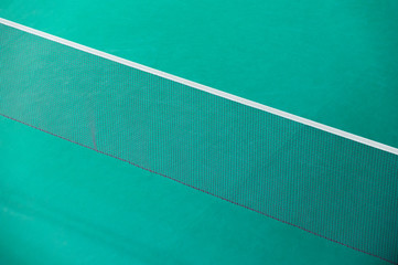Badminton net indoor on badminton court, closeup view of badmint