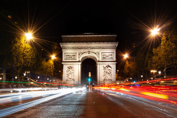 Arc de Triomphe at night, and traffic in Paris