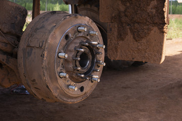 Maintenance a truck wheels hub and bearing .Rear wheels hub and bolt nut of a truck in process of changing wheel.  brake disc under repair