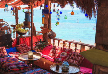 Arabic cafe or hookah on the beach - obrazy, fototapety, plakaty