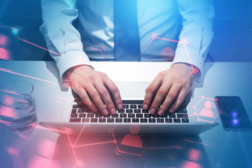 Businessman typing on laptop, people network