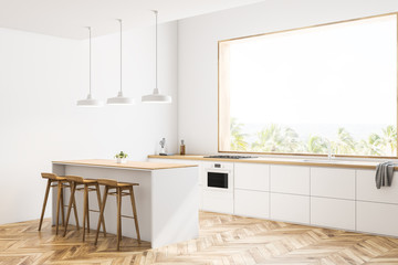 White kitchen corner with bar and stools