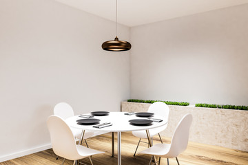 White dining room corner with round table