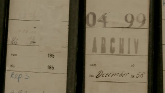 Slow camera movement via folders and archive files. There are more files behind the shelf.