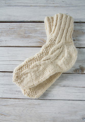 white wool sock on wooden surface