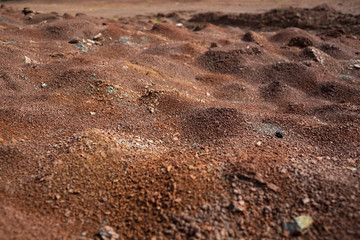 Red earth or soil background. Tropical laterite soil  background of red clay. Dry Orange surface, Picture of natural disaster. Drought land Caused by global warming and deforestation.