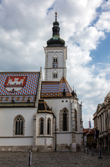 The Church of St. Mark, located in St. Mark's Square in Zagreb, Croatia, originated in the 13th century, reconstructed in the 14th century, featured the Zagreb Coat of arms on the roof.