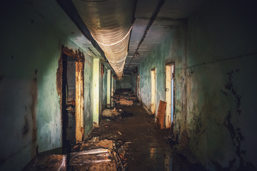 Dark flooded corridor or tunnel in old underground haunted and abandoned Soviet military bunker