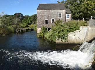 Mill house next to waterfall