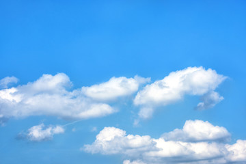 Fluffy white clouds on background of blue sky wallpaper