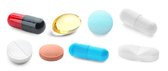 Set with different pills on white background