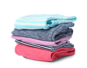 Stack of colorful children's clothes on white background