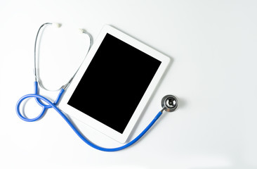 stethoscope and tablet on white background,copy space for your text