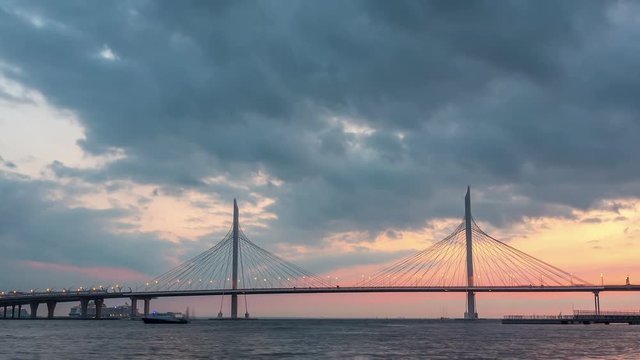 Beautiful bridge against the sunset sky. timelapse