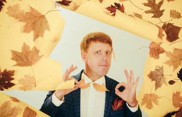 Happy young man are preparing for autumn sunny day. Fashion man. Surprise read head man playing...