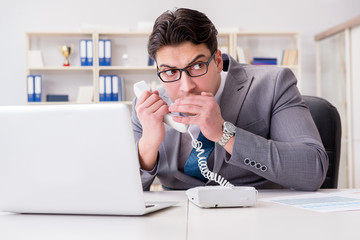 Businessman leaking confidential information over phone
