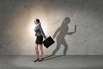 Businesswoman and his shadow in business concept