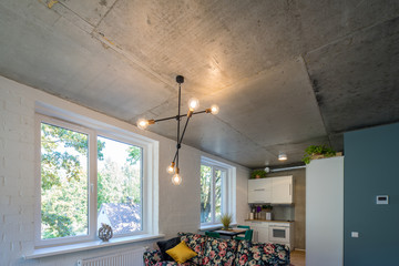 Concrete ceiling and lighting in a modern apartment. Concrete style in the apartment. © Aleks Kend