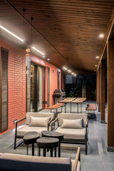 Trendy modern country house with luminous lamps