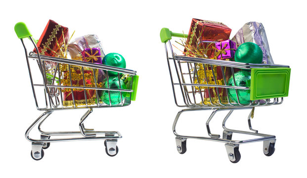 Isolated shopping cart with Christmas presents. Christmas and New Year composition. Side and angle view photo.