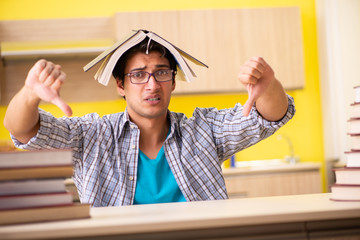 Student preparing for exam sitting at the kitchen 