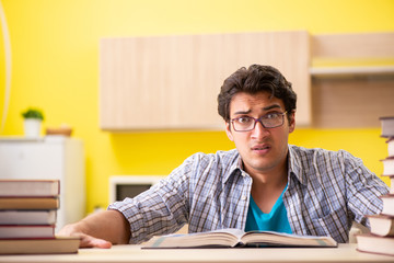 Student preparing for exam sitting at the kitchen 