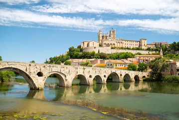 Old bridge and Saint Nazaire cathedral on the Orb river in Beziers, France
