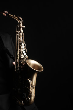 Saxophone player. Saxophonist with jazz musical instrument