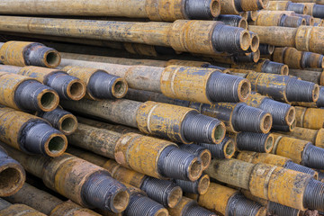 Drilling of oil and gas wells. Drill pipe inspection. Tubing for oil and gas listed on the pedestal out of the wells after washing and ready for inspection. Stack of casing laying on the deck