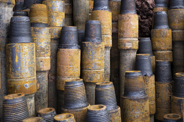 Drilling of oil and gas wells. Drill pipe inspection. Tubing for oil and gas listed on the pedestal out of the wells after washing and ready for inspection. Stack of casing laying on the deck