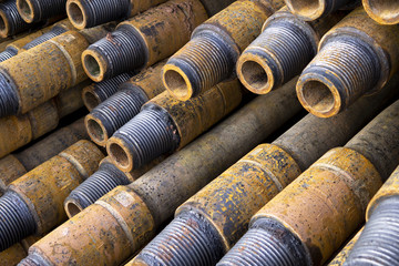 Drilling of oil and gas wells. Drill pipe inspection. Tubing for oil and gas listed on the pedestal out of the wells after washing and ready for inspection. Stack of casing laying on the deck