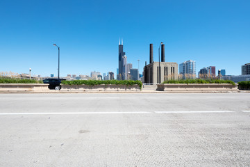 empty street through moder city in chicago