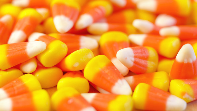 Macro closeup of Halloween traditional Candy Corn treats background.