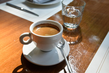 Dining table with cup of coffee