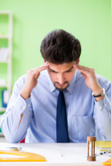 Young male architect working at the project