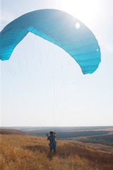 man parachute flying in the air