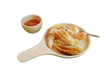 Croissant Chop on the wooden plate isolated on white background. This has clipping path.