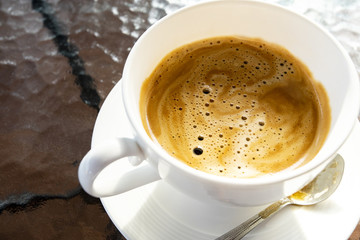cream of brewingg fresh coffee in white cup