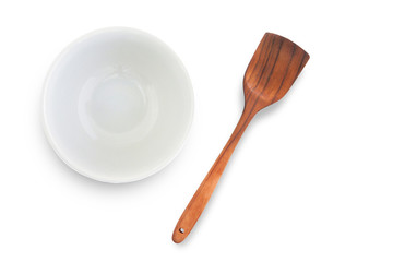 White cup and wooden spoon separated from the white background with clipping path