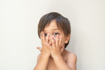 Cute baby boy toddler - hands on mouth