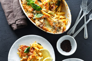 Baked pasta chicken ham mozzarella cheese pumpkin top view comfort food