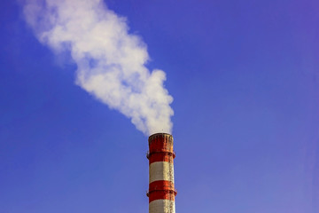 Air emissions from an industrial pipe. The smoke from the chimney, the problem of ecology