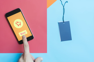smartphone on a colorful creative background buying and purchasing in internet shop concept...