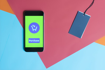 smartphone on a colorful creative background buying and purchasing in internet shop concept...