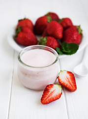 Jar with strawberry yogurt